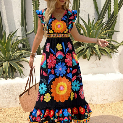 Élodie – Robe longue bohème à col en V, taille ceinturée, ourlet à volants